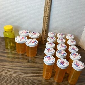 Lot of 20 various sizes of empty plastic prescription storage bottles.